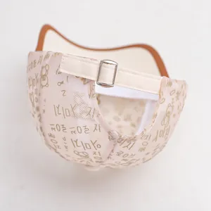 Detail of toddler mesh sun hat showing beige breathable fabric and metal buckle
