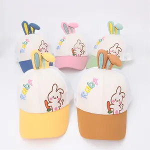 Detail of colorful mesh baseball caps for kids with rabbit ears and cute cartoon embroidery