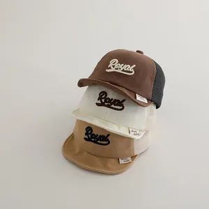 Stack of breathable mesh baseball caps for kids with Royal embroidery in three colors
