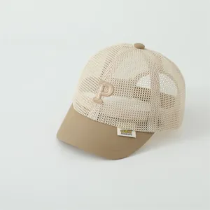 Detailed view of breathable mesh back and embroidered P letter on kids summer baseball cap