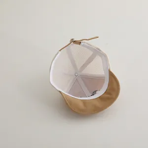 Detailed inner view of khaki baby mesh cap showing white mesh panels and stitching