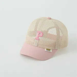 Detail of pink P letter embroidery on breathable mesh kids baseball cap for summer sun protection