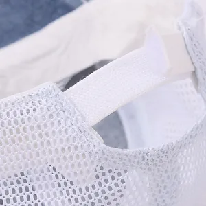 Breathable mesh texture and adjustable white plastic buckle on a kids baseball cap