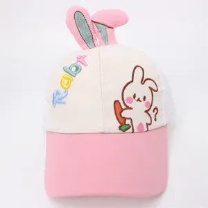 Close-up of pink bunny ears and rabbit embroidery on a breathable kids mesh cap