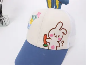 Detail view of breathable mesh child baseball cap with blue 3D rabbit ears and embroidery