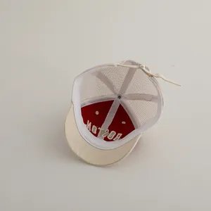 Detail view of the breathable mesh back and adjustable strap on the BOSTON kids cap
