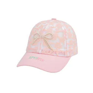 Pink and white lace mesh baseball cap for girls with sports embroidery and bow detail