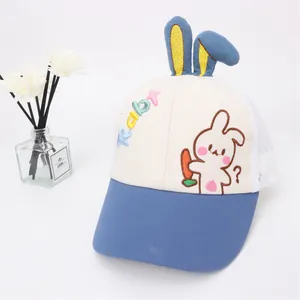 Detail of blue and white mesh baseball cap for kids with cute bunny ears and embroidery