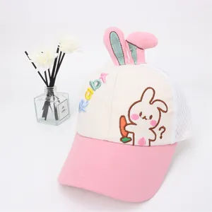 Detail of pink mesh cap for kids with cute rabbit ears and colorful embroidery