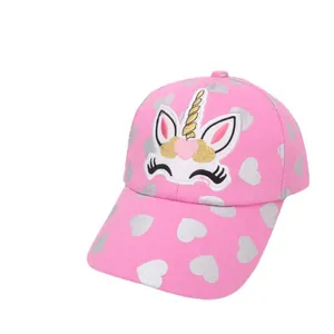 Pink kids baseball cap with unicorn embroidery and silver heart patterns on white background