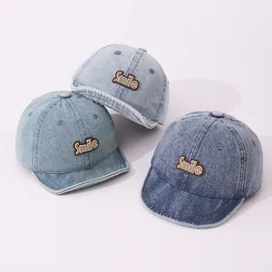 Three colors of kids vintage washed denim baseball caps with Smile patch embroidery