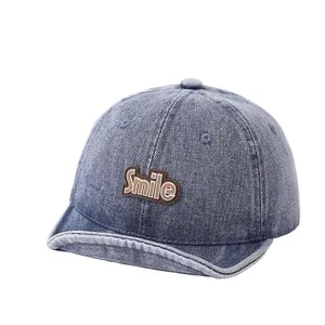 Toddler smile patch washed denim baseball cap with soft short brim in mid-blue color