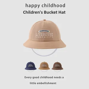 Close-up of children's cotton bucket hats with Livehouse letter embroidery in three colors