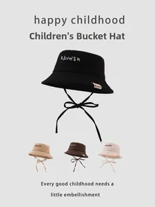 Detail view of cotton kids bucket hats in four colors with adjustable chin straps