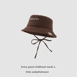 Brown kids bucket hat with RANHSR letter embroidery and adjustable chin strap