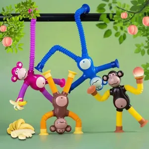 Detail view of colorful cartoon monkey toys with stretchable limbs and suction cups