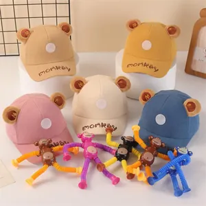 Detailed collection of kids corduroy baseball caps with colorful suction cup monkey toys