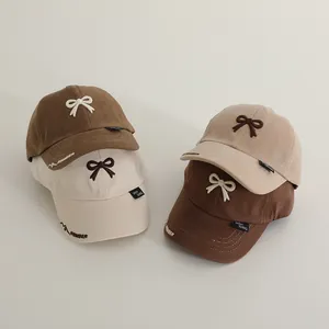 Set of four cotton baseball caps for kids with bow embroidery and letter stitching