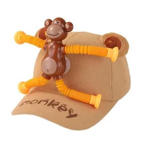 Creative children's monkey baseball cap with plush ears and detachable fidget toy