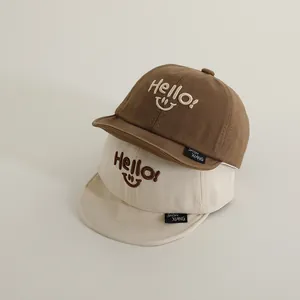 Kids soft brim baseball caps with smile embroidery in brown and beige colors