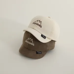 Kids short brim baseball cap in beige and brown cotton with mountain embroidery