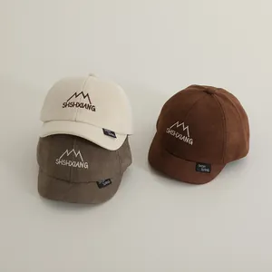 Short brim toddler baseball caps in beige and brown with mountain embroidery design