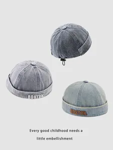 Detail of adjustable denim Miki hats in three washes with BOSTON embroidery