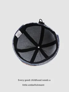 Internal view of denim brimless cap showing reinforced seams and washing label