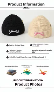 Detail view of knitted toddler beanie with bow embroidery showing material and size specs