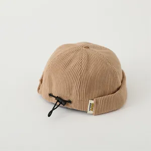 Khaki corduroy brimless docker hat for babies with adjustable cord and lucky bear style