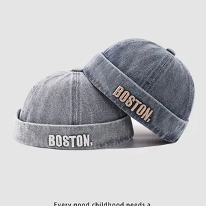 Washed blue denim docker hats with Boston letter embroidery in a retro vintage style