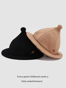 Detail of ribbed knit wizard hats for kids in black and khaki with cloud leather patch