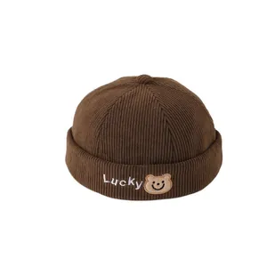 Deep brown corduroy miki hat for kids with Lucky bear embroidery on white background