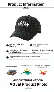 Detail view of green plaid baseball cap for kids with white Boston embroidery and sizing