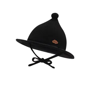 Infant black corduroy knit witch hat with earflaps and adjustable chin strap