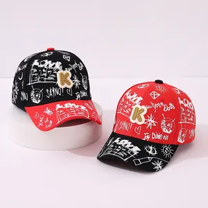 Kids' street style baseball cap with graffiti letters and K-patch in red and black