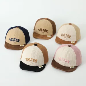 Close-up of colorful corduroy baseball caps with BOSTON 1630 embroidery for kids