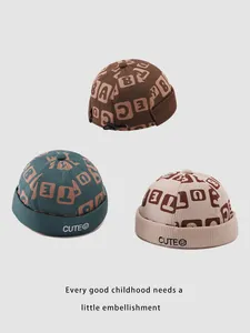Detailed texture of corduroy kids dockers caps in green brown and beige colors