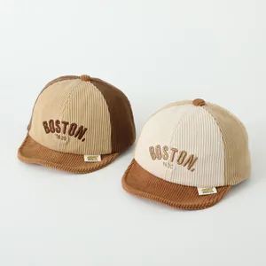 Detailed close-up of corduroy texture and Boston 1630 embroidery on toddler baseball caps