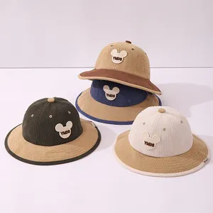 Detail of corduroy texture and bear pattern embroidery on toddler winter bucket hats