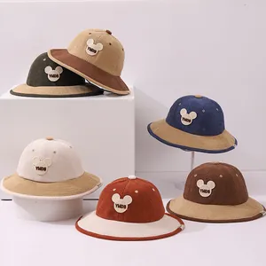 Detailed view of kids corduroy bucket hats in six colors with bear silhouette patches