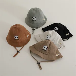 Close-up of five colorful waffle knit kids bucket hats with cute panda embroidery and chin straps