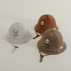 Kids waffle texture panda bucket hats in beige, yellow and brown with adjustable wind strings