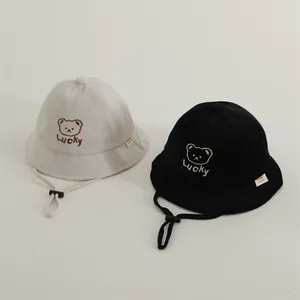 Detail of baby bear bucket hats with Lucky embroidery and adjustable windproof straps