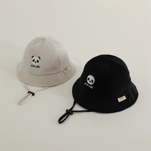Kids panda bucket hat in black and cream waffle cotton with adjustable chin strap