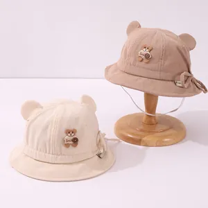 Close-up of corduroy baby bucket hats with cute bear ears and bear embroidery patches
