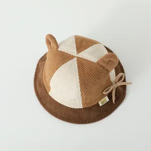 Close-up of baby corduroy bucket hat with cute 3D ears and patchwork design