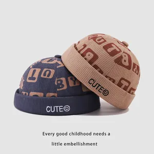Corduroy CUTE miki hat for kids in blue and brown with embroidered smiley face detail