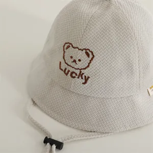 Toddler waffle knit bucket hat with Lucky bear embroidery and adjustable chin strap