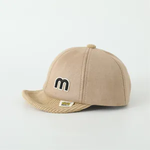 Khaki baby baseball cap with M patch and corduroy brim for kids aged 0-3 years